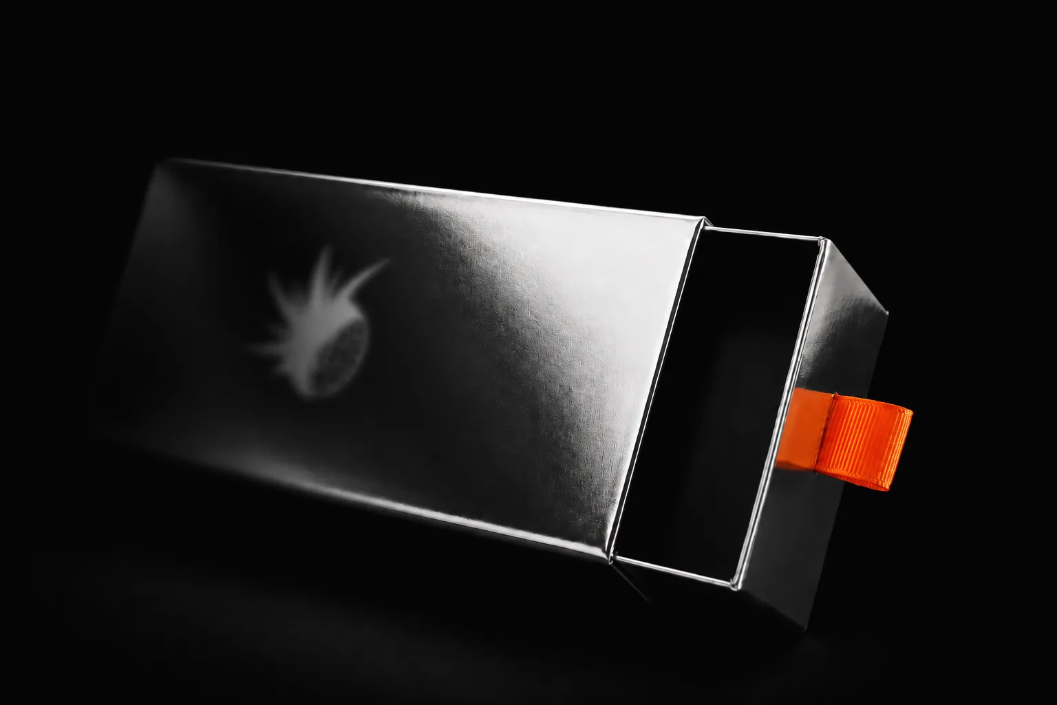 Silver EYEZ box, showing the emblem, open drawer and orange pull tab