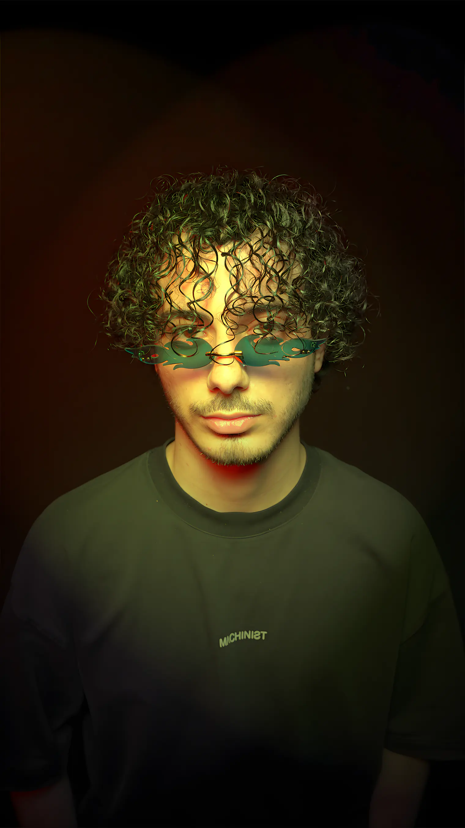 A model wearing BLAZE sunglasses in Green Mirror