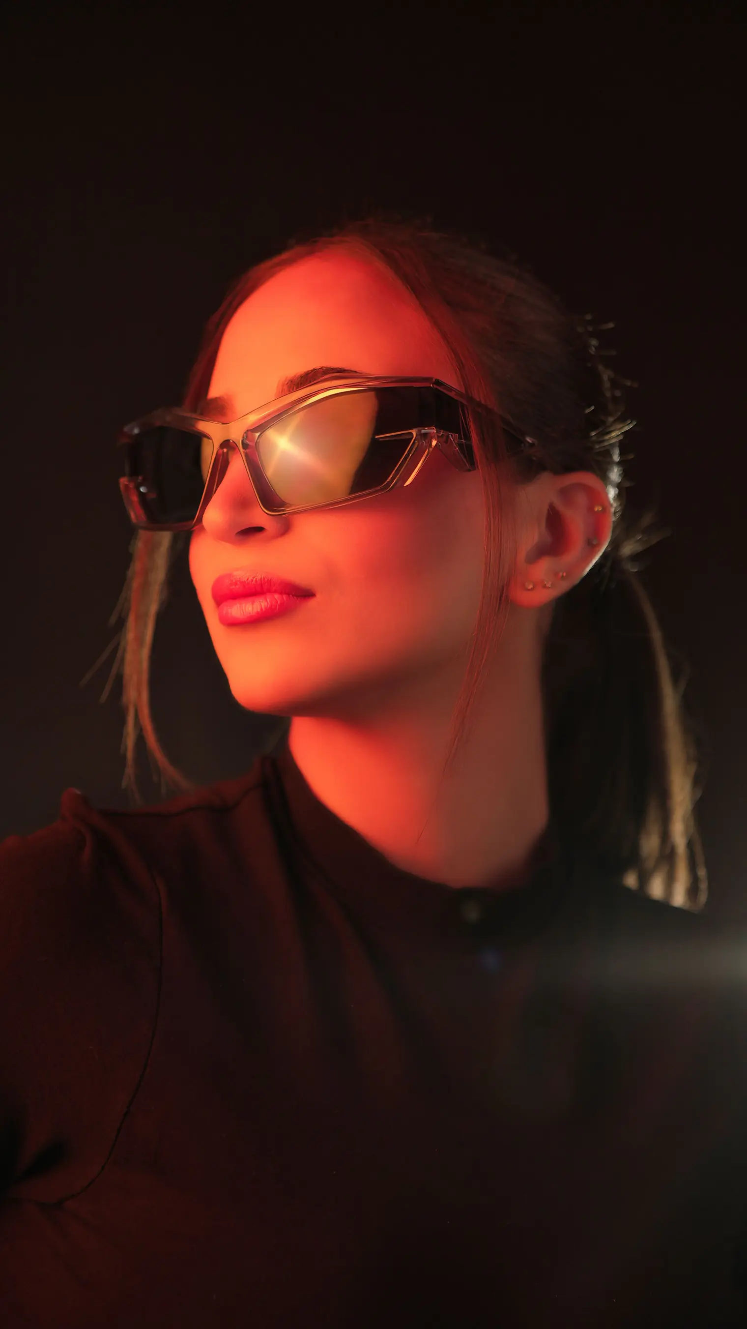 A model wearing RUSH sunglasses in Transparent